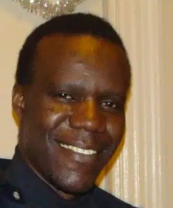 Portrait of Samba B. Seck smiling at a social event.